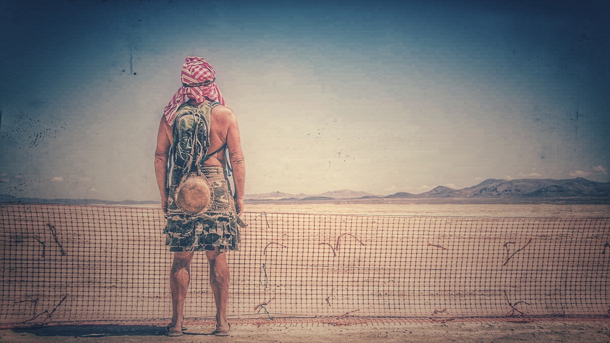 A Man standing in the desert, taken from burning man festival